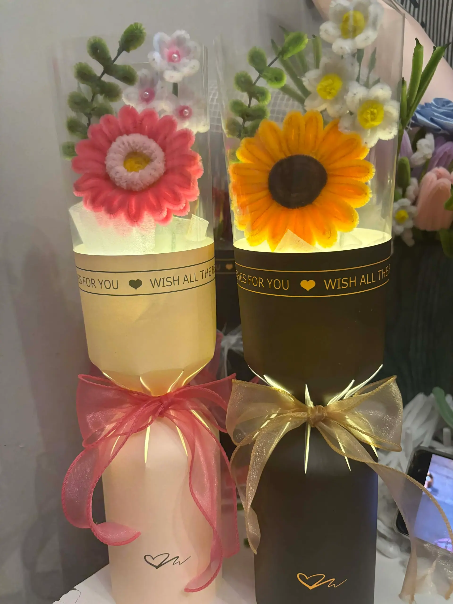 FleurKraft LED light bouquets — sunflower and gerbera daisy designs in gift cylinders